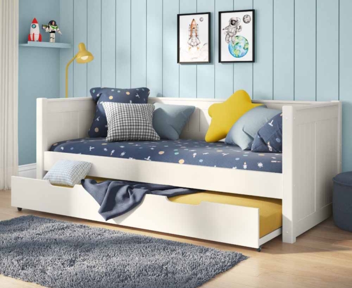 White Stompa Classic Daybed with tongue and groove details in the head board and foot board and a trundle bed with mattress