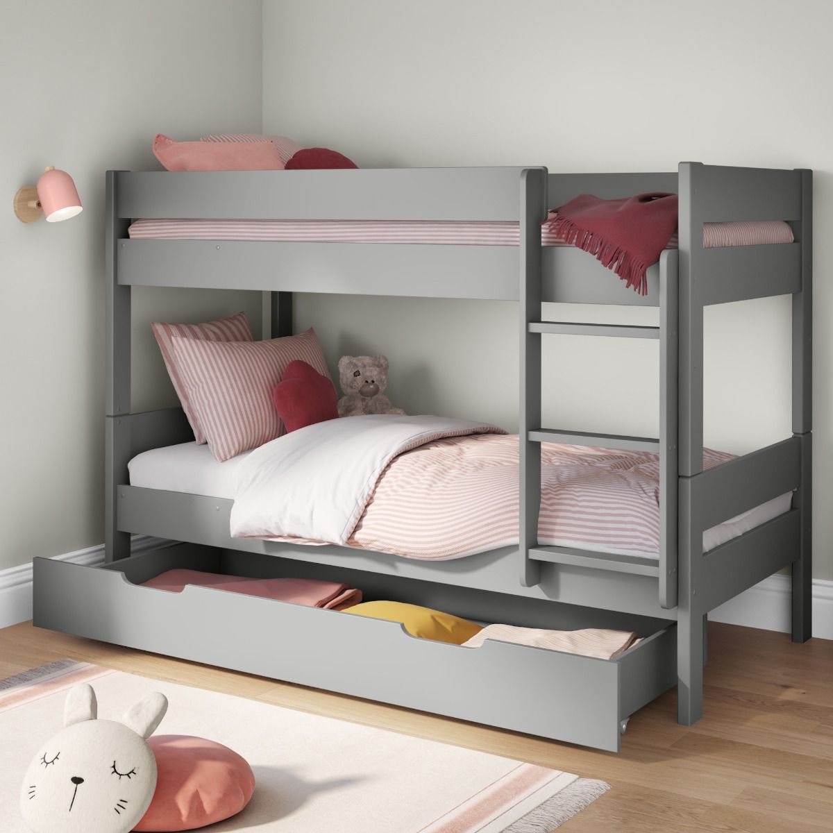 Zoomed Angled View of Compact Grey Detachable Bunk Bed with Trundle Drawer