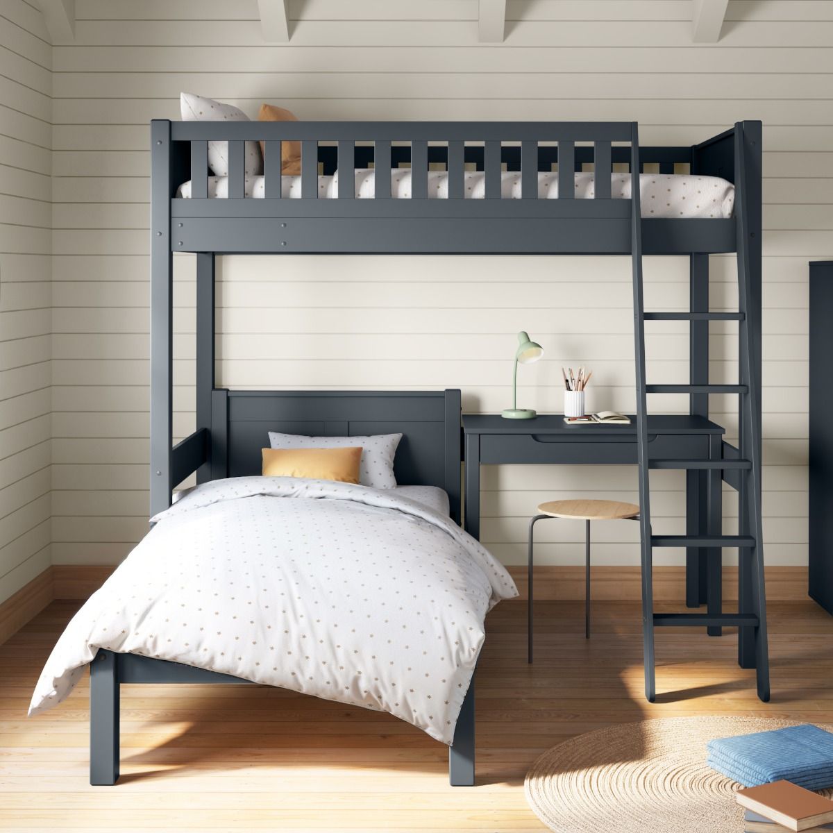 Closer front view of Arven heritage blue high sleeper with L-shaped single bed and freestanding storage desk in Scandinavian-inspired bedroom with calm cream tongue and groove walls, timeless textiles and subtle 1960s retro accents.