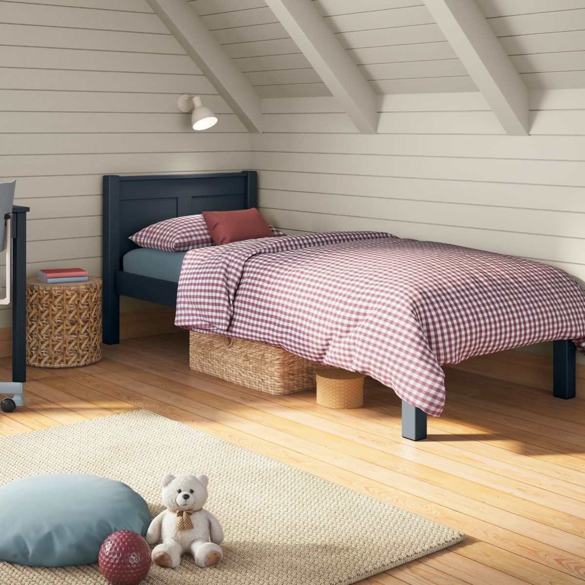 Closer view of Arven Blue Single Bed in a Scandinavian room setting styled with red and white gingham bedding and muted blue.