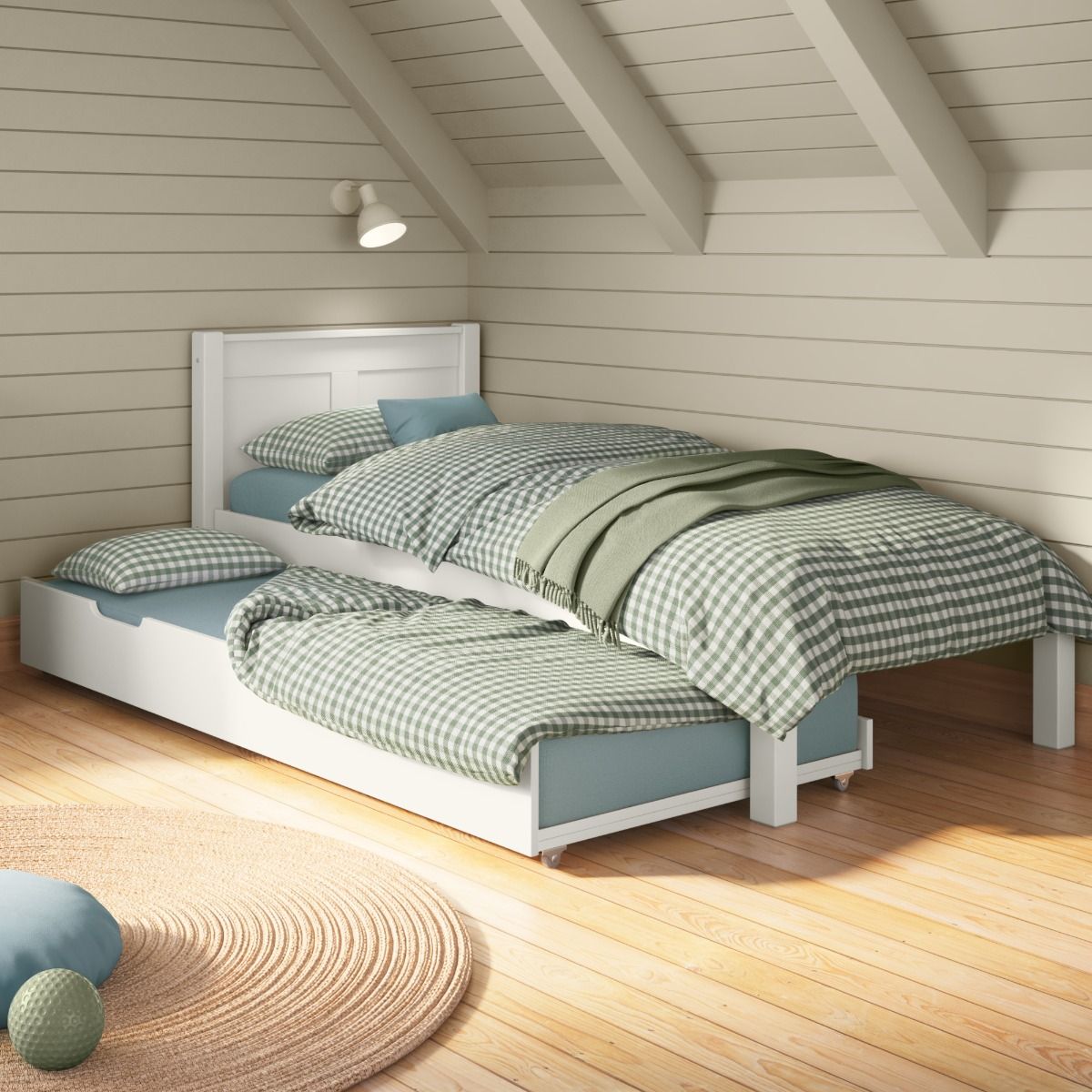Closer view of Arven White Single Bed with Trundle bed in a calm bedroom styled with soft blue and green gingham bedding and cream painted wall panelling.