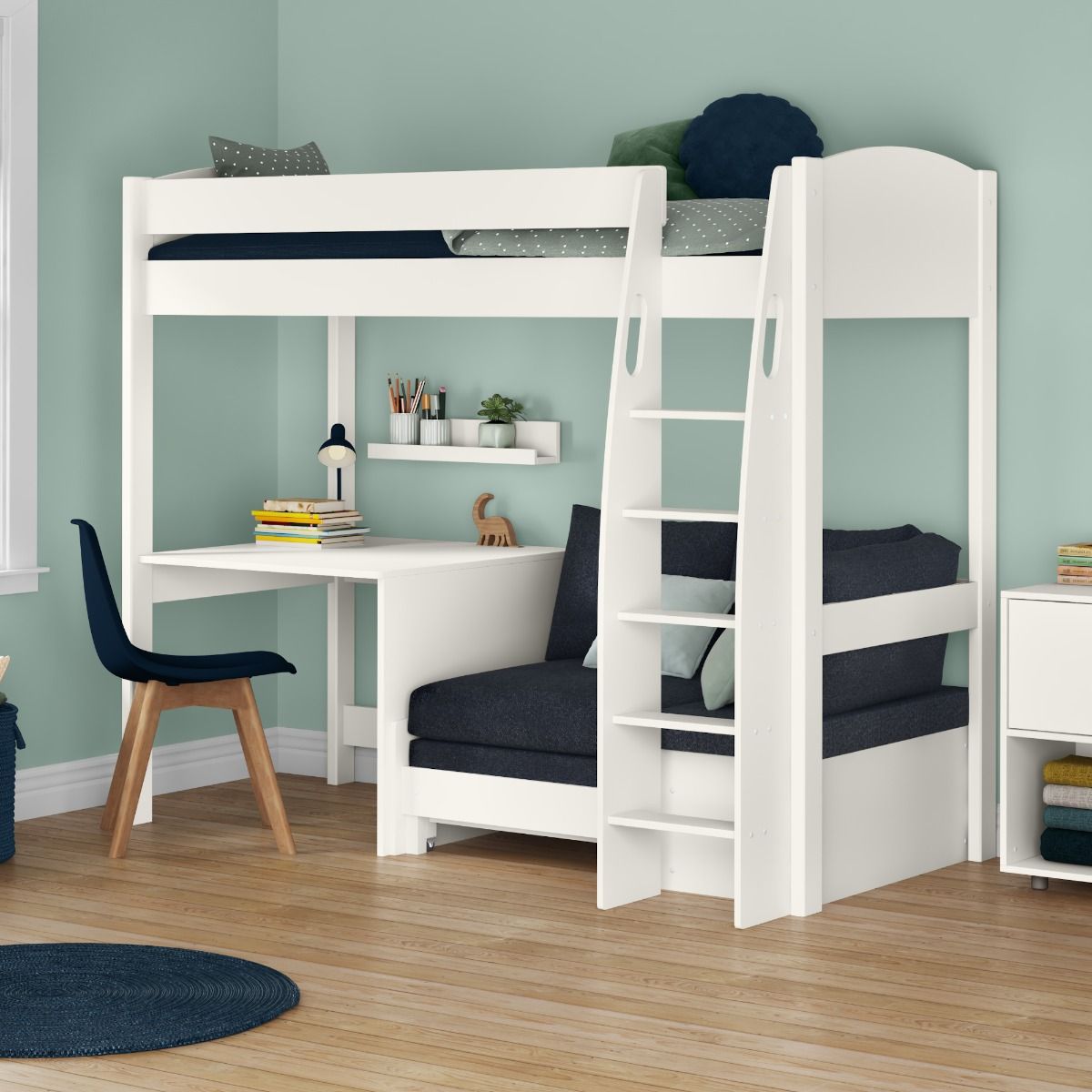 Zoomed Angled View of Uno S White High Sleeper with Fixed Desk and Ocean Blue Sofa Bed