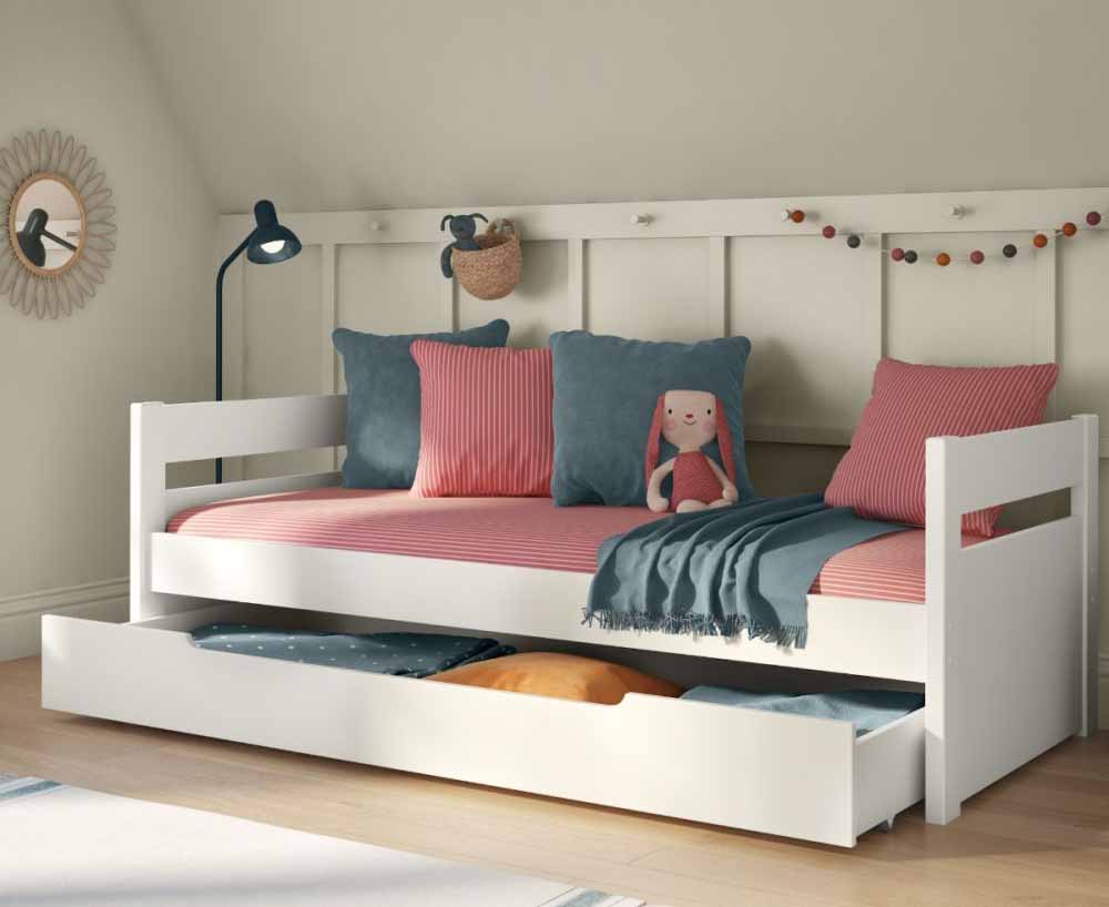 A white cabin bed with a trundle bed under the bed.