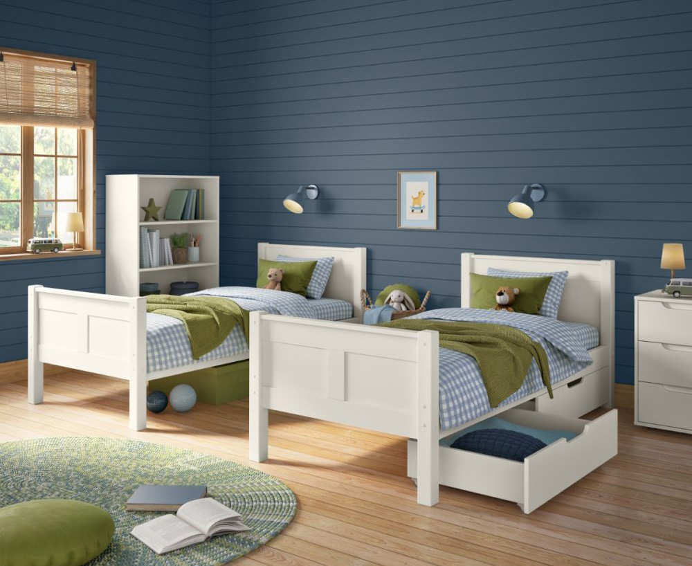 White detachable bunk bed separated into 2 single beds in shared bedroom