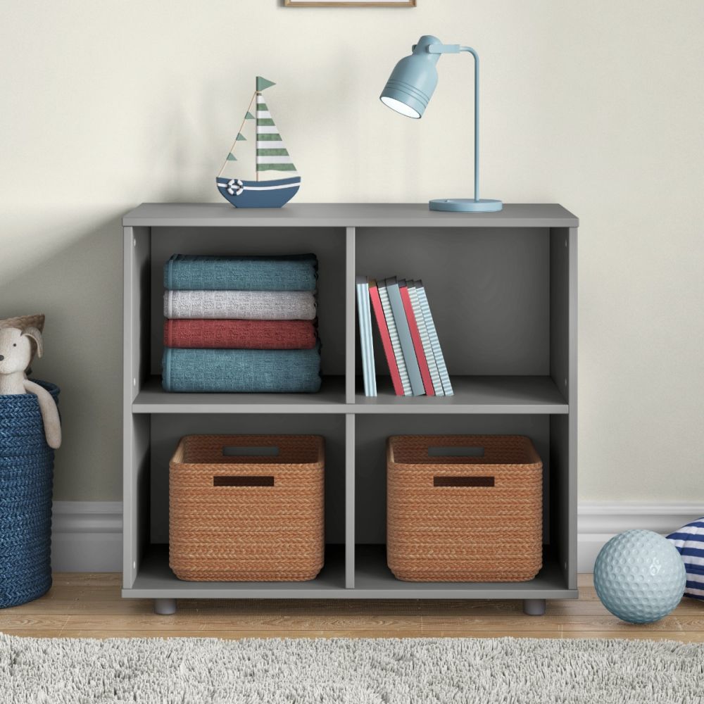 Grey furniture storage unit divided into four equal compartments for easy storage